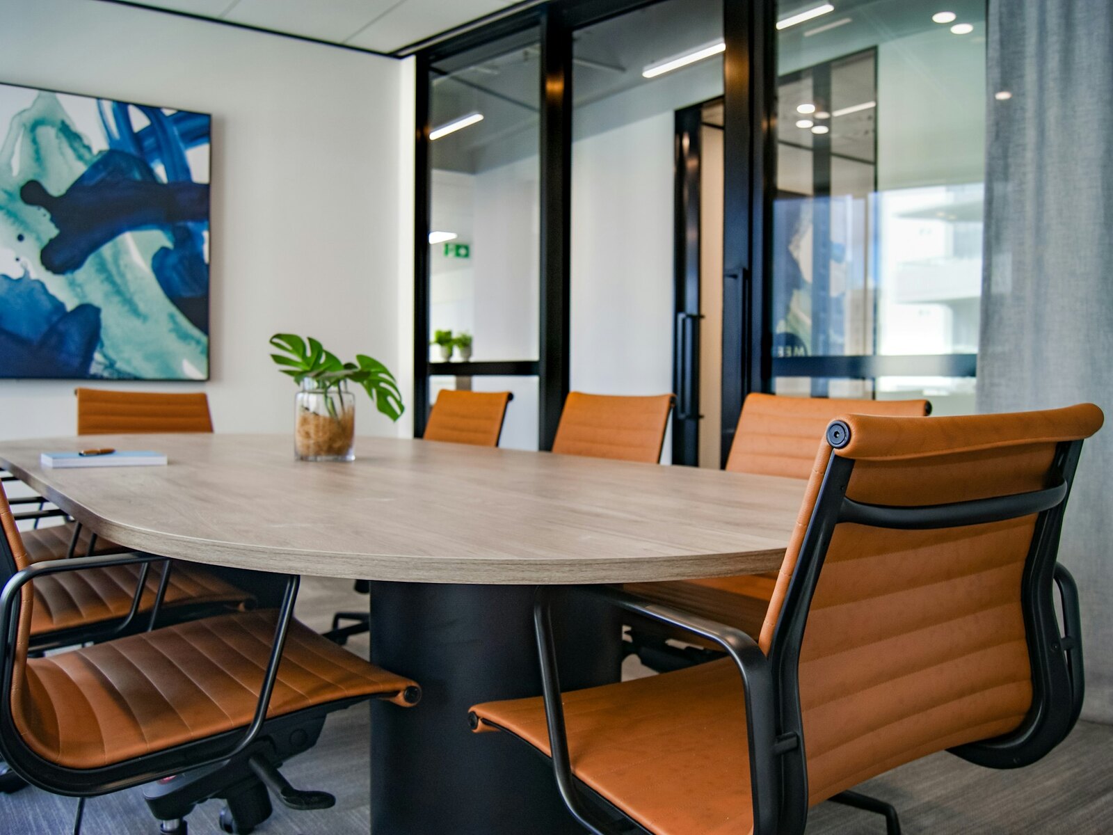 A calm, light meeting room with a large window